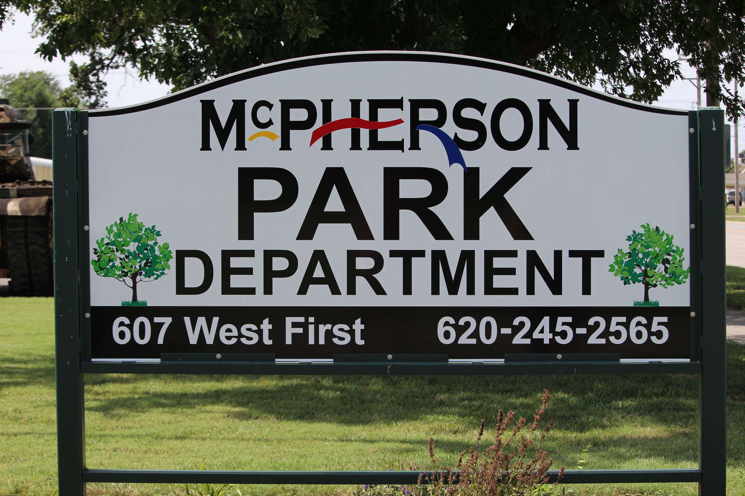An outdoor sign identifying the McPherson Park Department